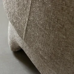 Fauteuil arrondi en tissu taupe Norton