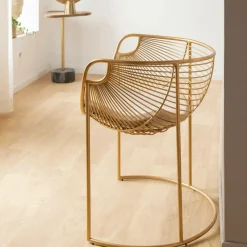 Fauteuil design en métal doré Augustus