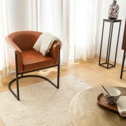 Fauteuil en cuir marron et métal Sacha